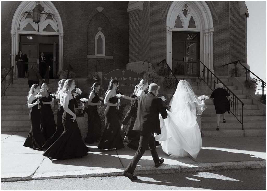 bride walking into her wedding ceremony at a Boston church, taken by documentary wedding photographer Kelly Stevens