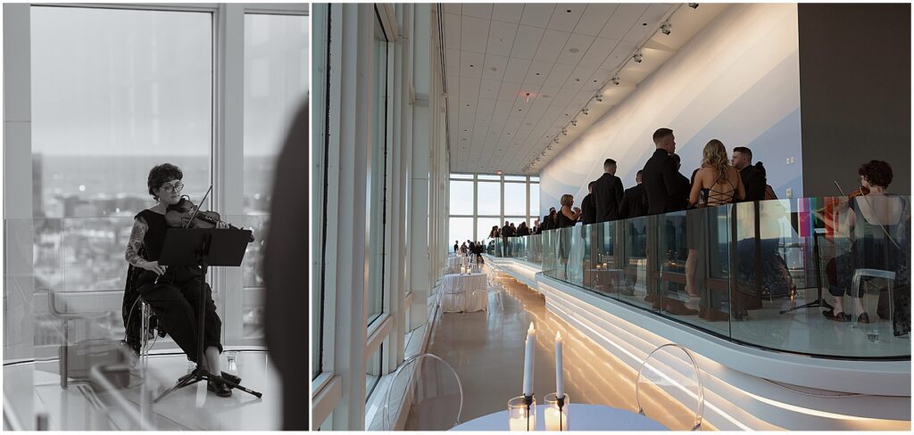 Guests at cocktail hour for a View Boston wedding, with a live violinist